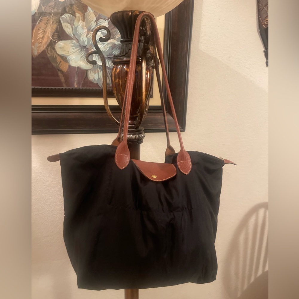 Longchamp please check all picture of condition the zip is not working properly